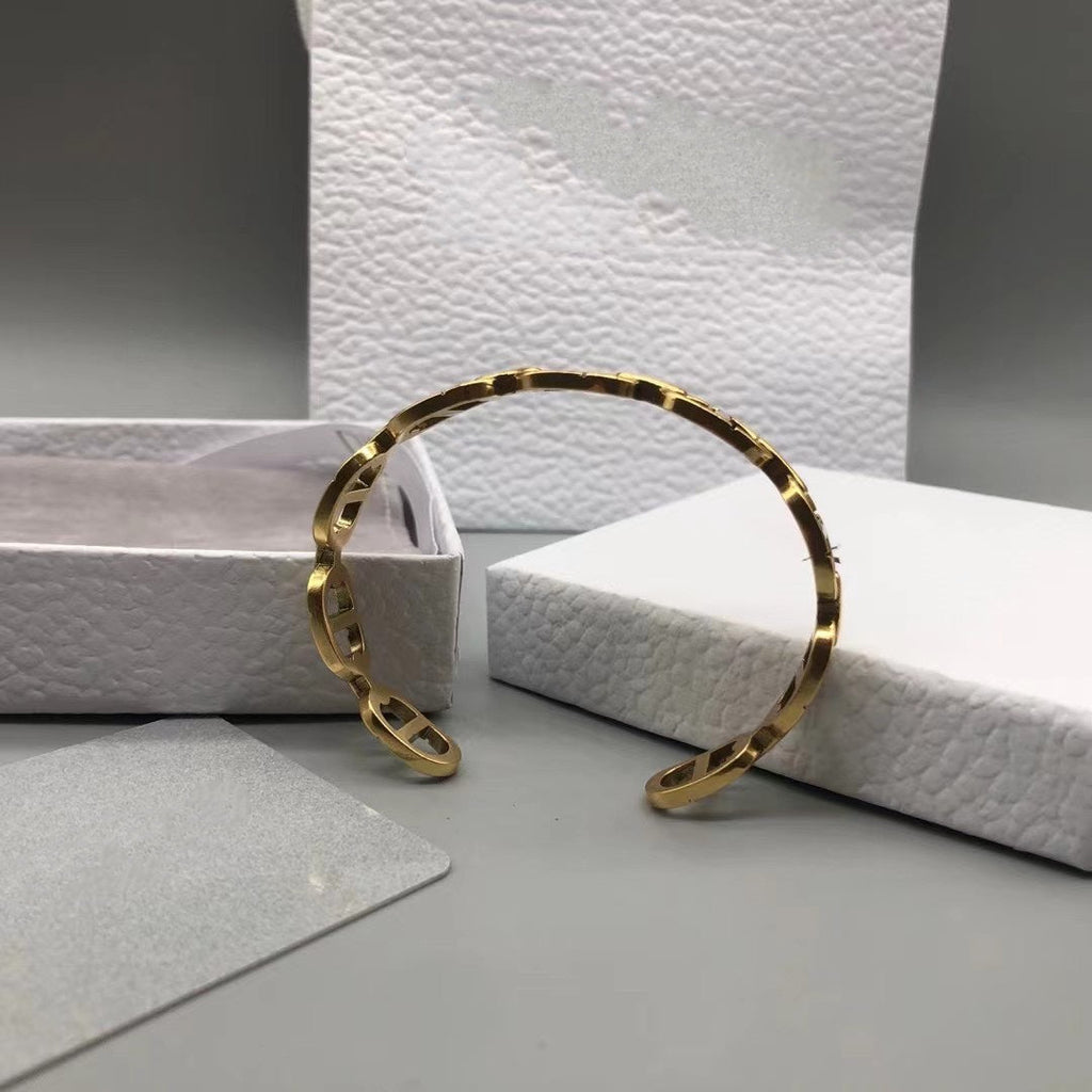 DIOR CD MOTIF GOLD CUFF BRACELET
