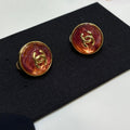 Chanel Gripoix Earrings With Gold Chanel Logo And Red Glass Stones
